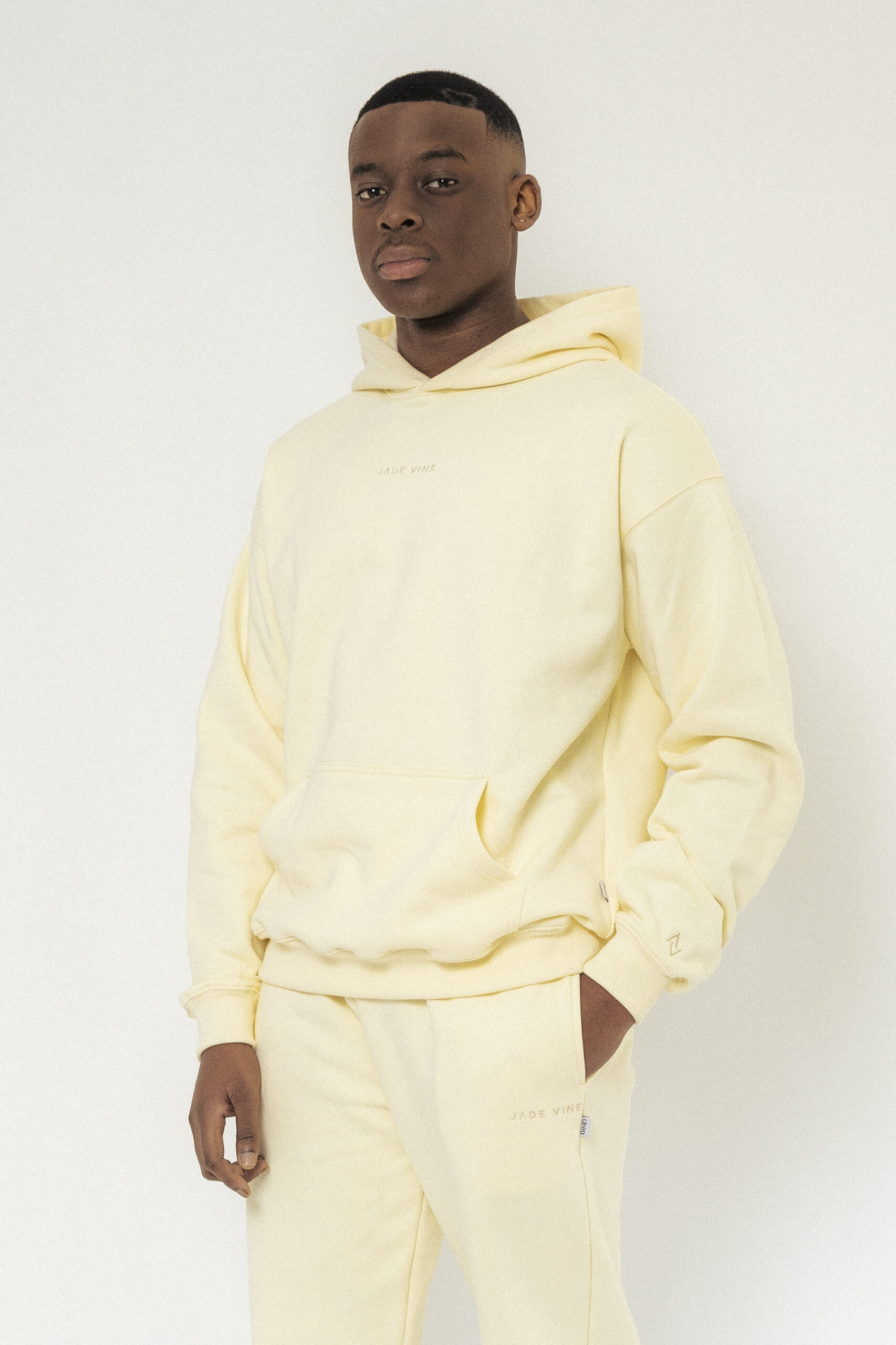 Fear of god essentials online lemonade pullover hoodie yello